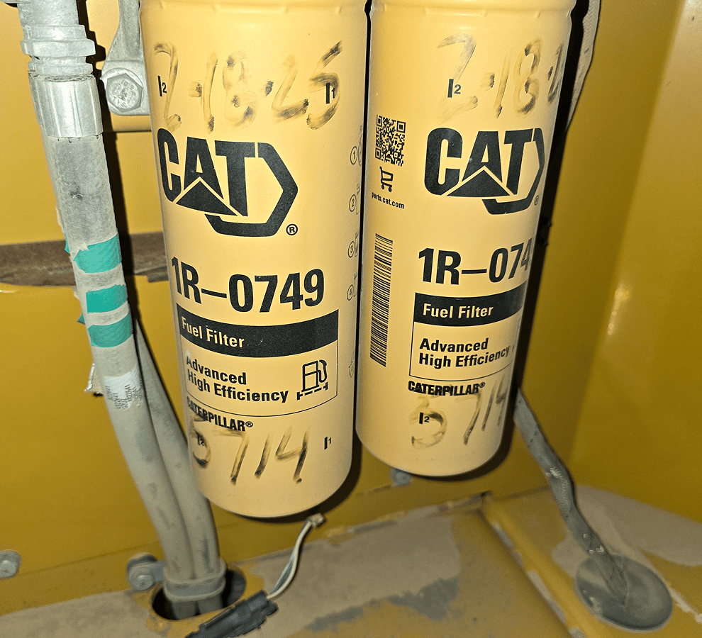CAT fuel filters with yellow background.