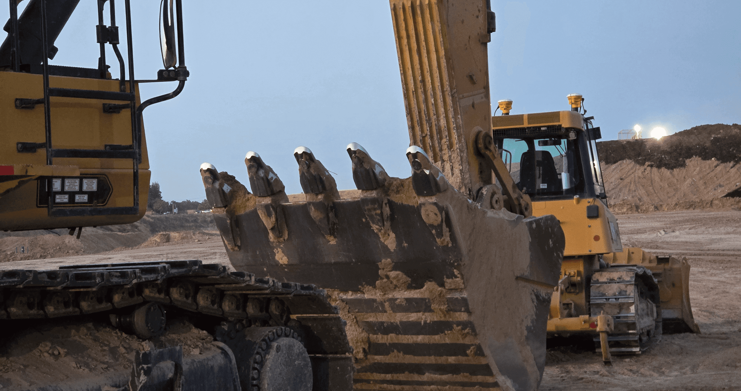 Excavator and bulldozer at construction site.