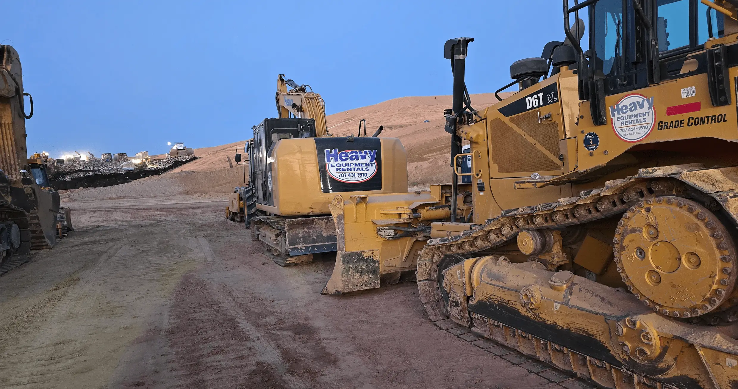 Construction site with heavy machinery and bulldozers.